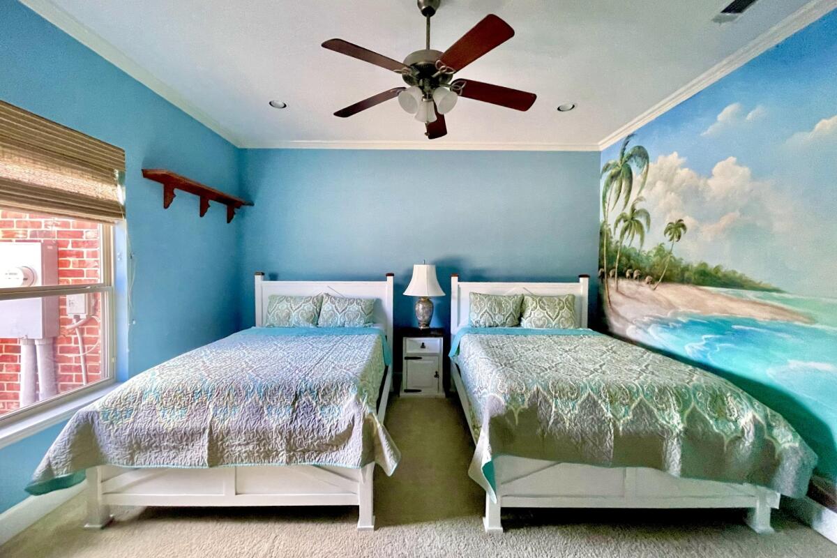 Blue bedroom onsite accommodation at the dream ranch