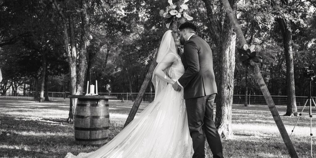 DIY outdoor ceremony area under the shade of trees at Dream Ranch event venue located in Dallas,TX