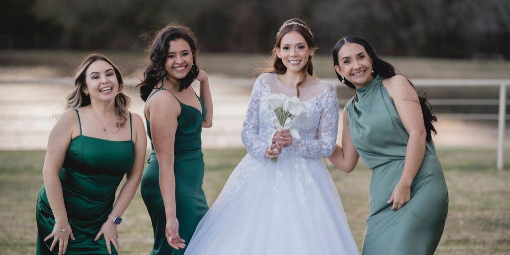 Bride capturing a candid selfie with bridesmaids
