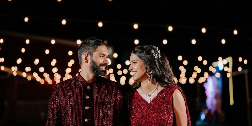 Bride groom under dazzling warm lights at wedding venue near McKinney,TX