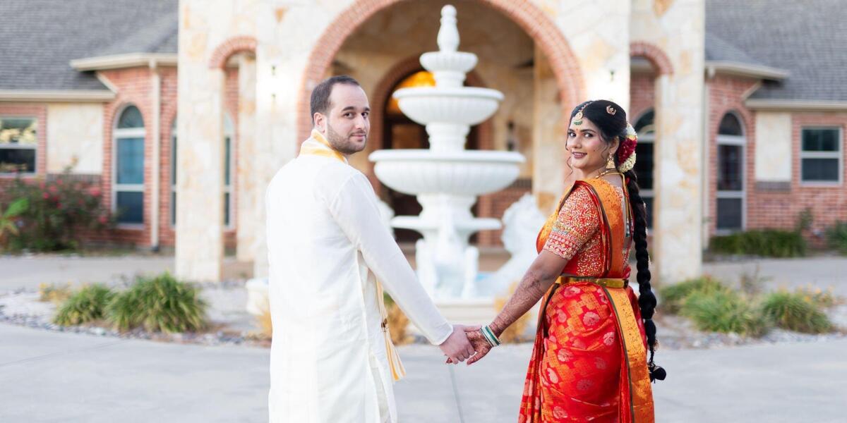 Couple celebrating their wedding at an elegant Greenville, TX venue